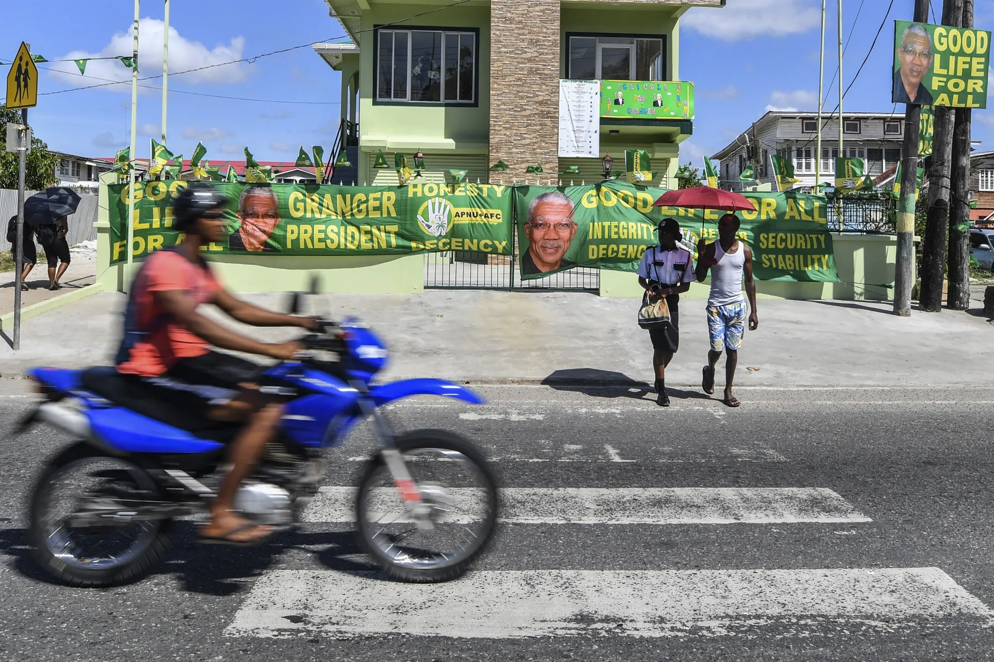 National Unity and Alliance for Change posters depicting an image of David Granger sit on a building in Georgetown, Guyana, on March 1.