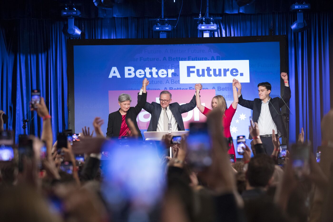 Anthony Albanese, leader of the Labor Party, second left, on stage with his partner Jodie Haydon, second right, his son Nathan Albanese, right, and Penny Wong, Australia's shadow foreign minister, on Saturday, May 21, 2022.