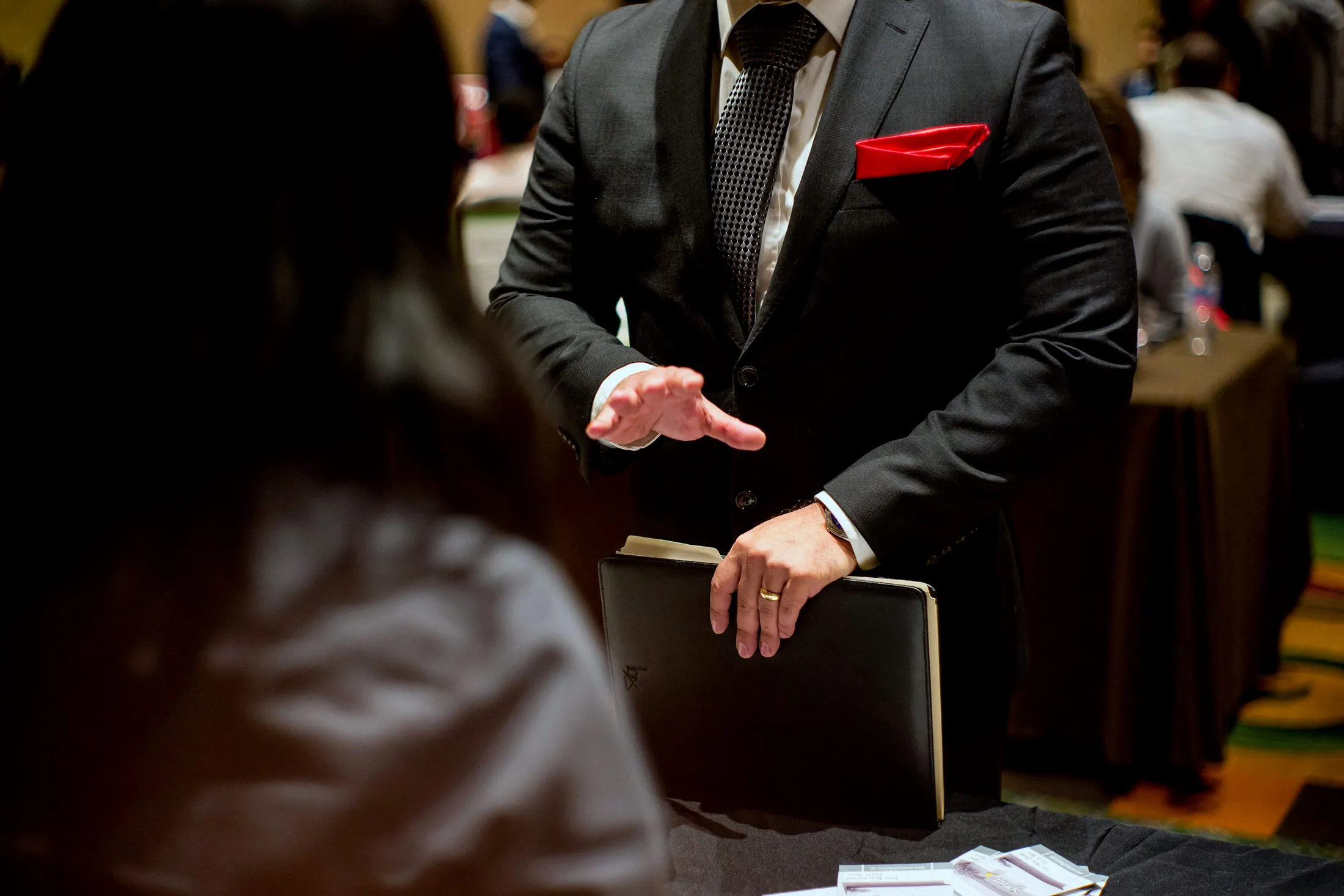 An attendee, right, speaks with a job recruiter at the San Jose Career Fair in San Jose, Calif., on Nov. 10.
