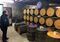 David Thomson surveys the casks of Scotch aging in Annandale's bonded warehouse.
