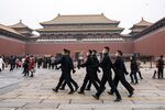 Members of the People’s Liberation Army honor guard in plain clothes march through the Forbidden City in Beijing, China, on March 3.