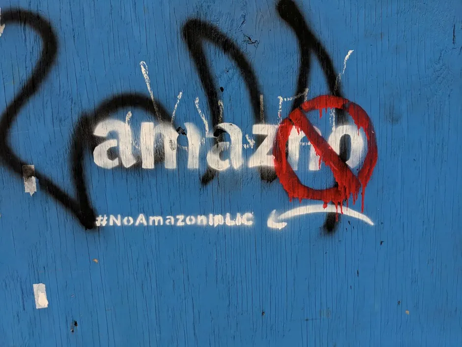 Graffiti in a vacant lot in Long Island City sends a clear signal: The company isn't welcome.