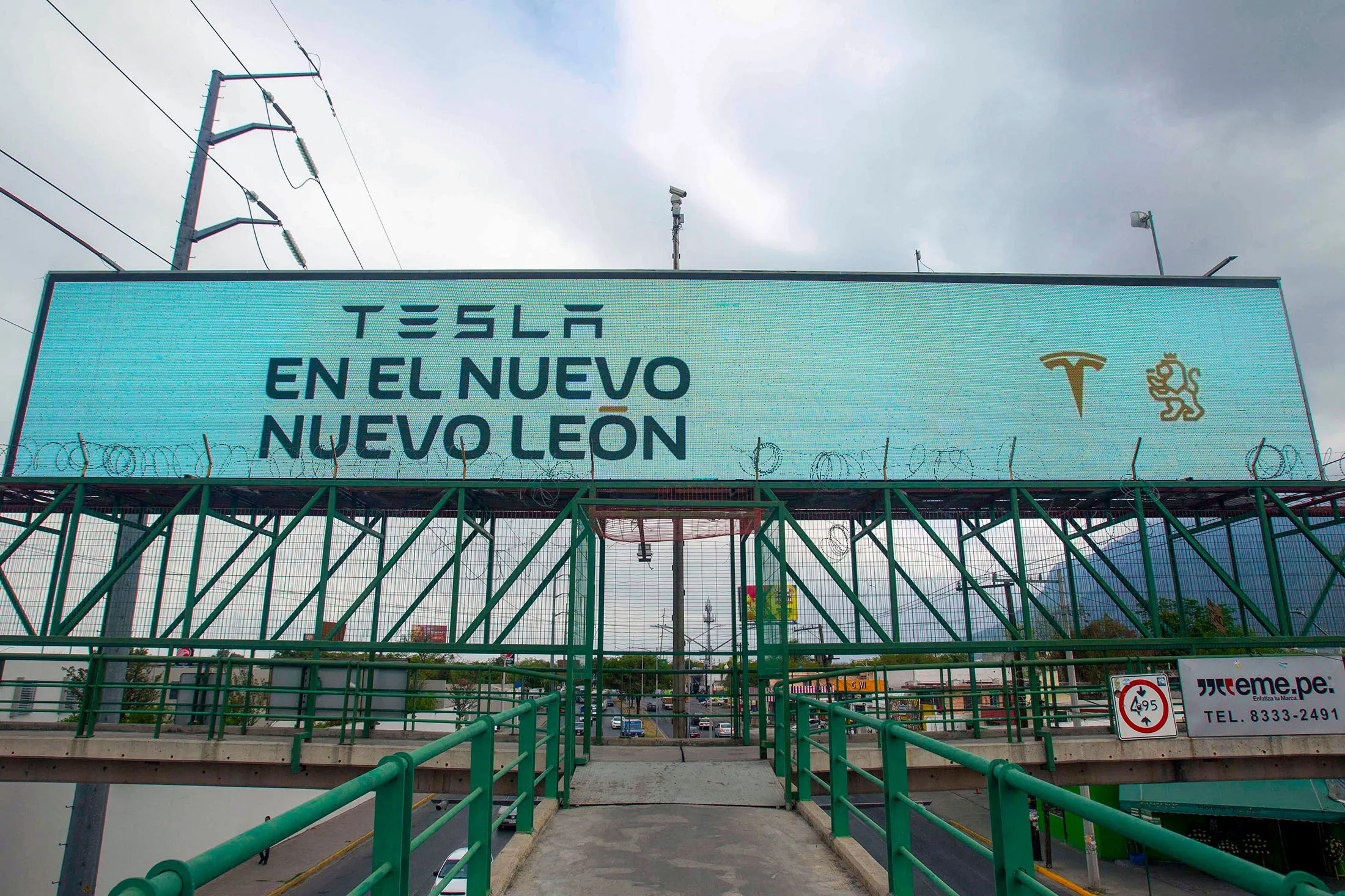 A billboard announcing the arrival of the American electric car maker Tesla is seen in Monterrey, state of Nuevo Leon, Mexico, on March 12, 2023.