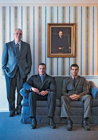 Zahn (standing) with sons Price (funeral director) and Evan (mortuary student)