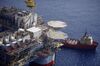 The Kobe Chouest platform supply vessel sits anchored next to the Chevron Corp. Jack/St. Malo deepwater oil platform in the Gulf of Mexico in the aerial photograph taken off the coast of Louisiana, U.S., on Friday, May 18, 2018. While U.S. shale production has been dominating markets, a quiet revolution has been taking place offshore. The combination of new technology and smarter design will end much of the overspending that's made large troves of subsea oil barely profitable to produce, industry executives say.