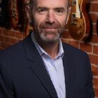 Headshot of John Reid