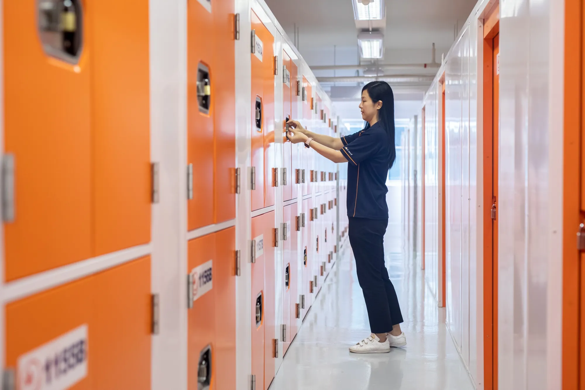 A worker shows the interior facilities of StorHub.
