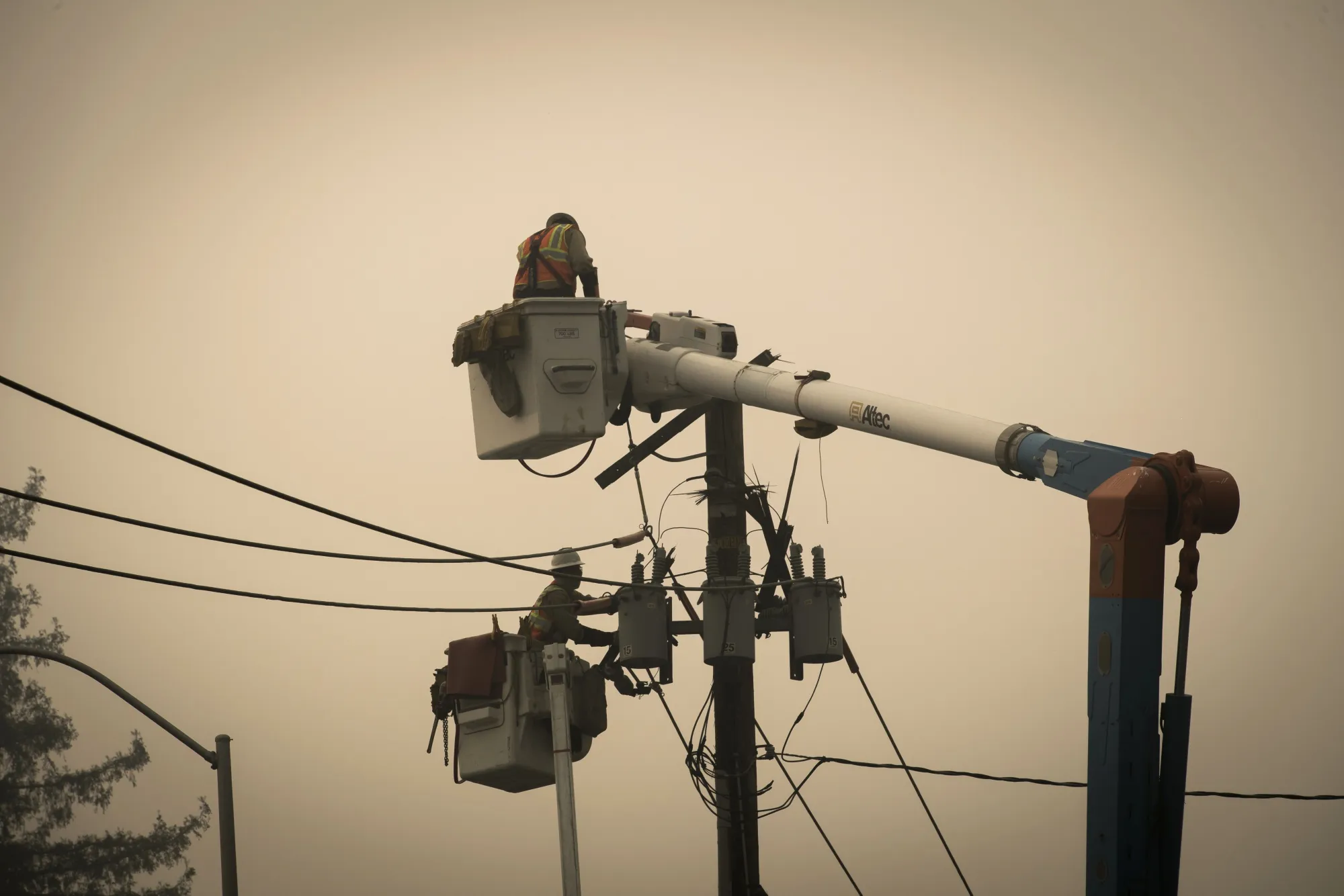 Pacific Gas & Electric Co. workers repair a transformer in Paradise, California, on Nov. 15, 2018.