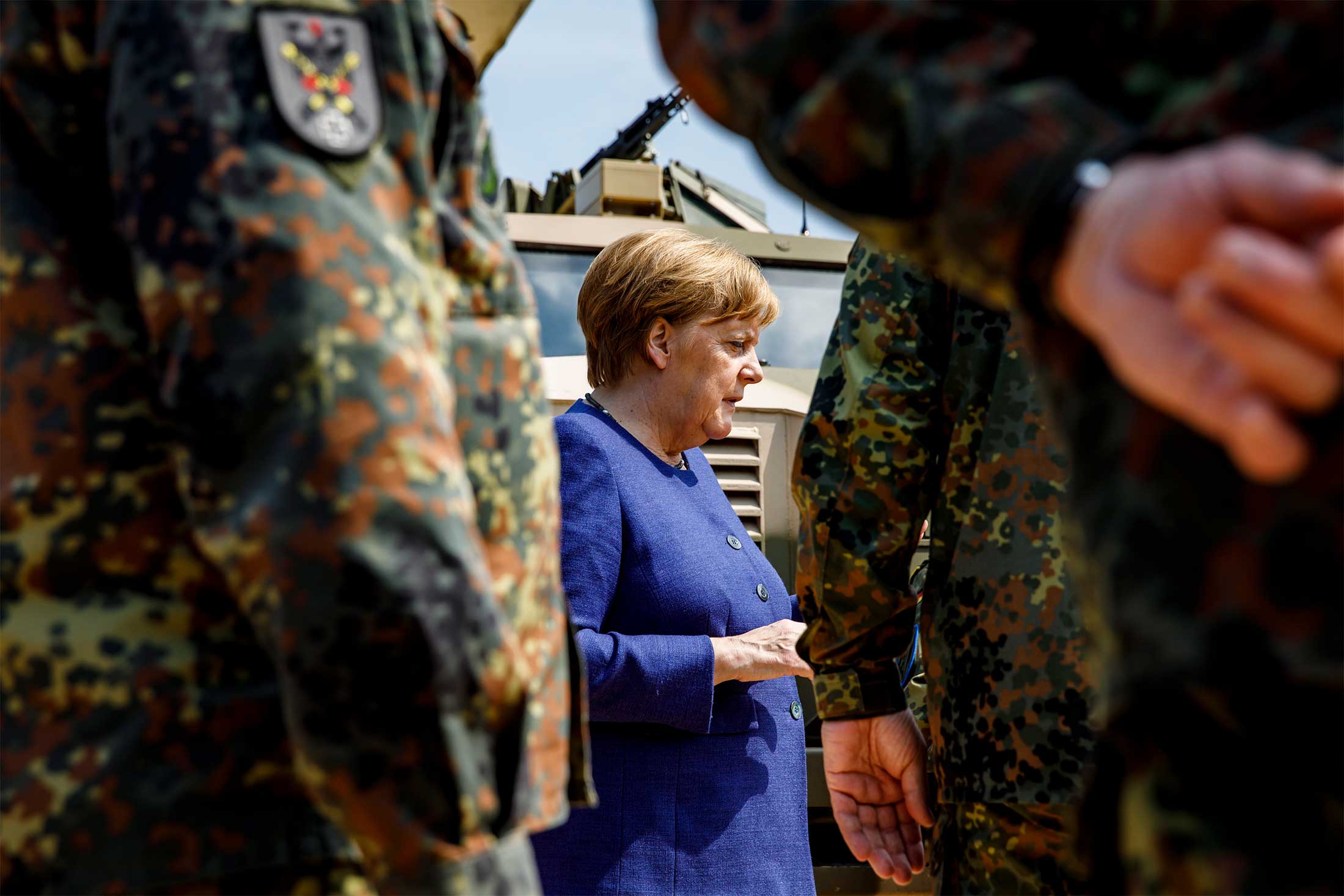 Angela Merkel greets members of the Bundeswehr Panzerlehrbrigade 9 in 2019.