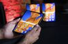 An employee holds a Mate Xs folding smartphone, manufactured by Huawei Technologies Co., at a launch event in London, U.K., on Tuesday, Feb. 18, 2020. The Chinese company on Monday announced a second-generation version of its Mate X folding phone, which up to now has been sold mostly in its home country.