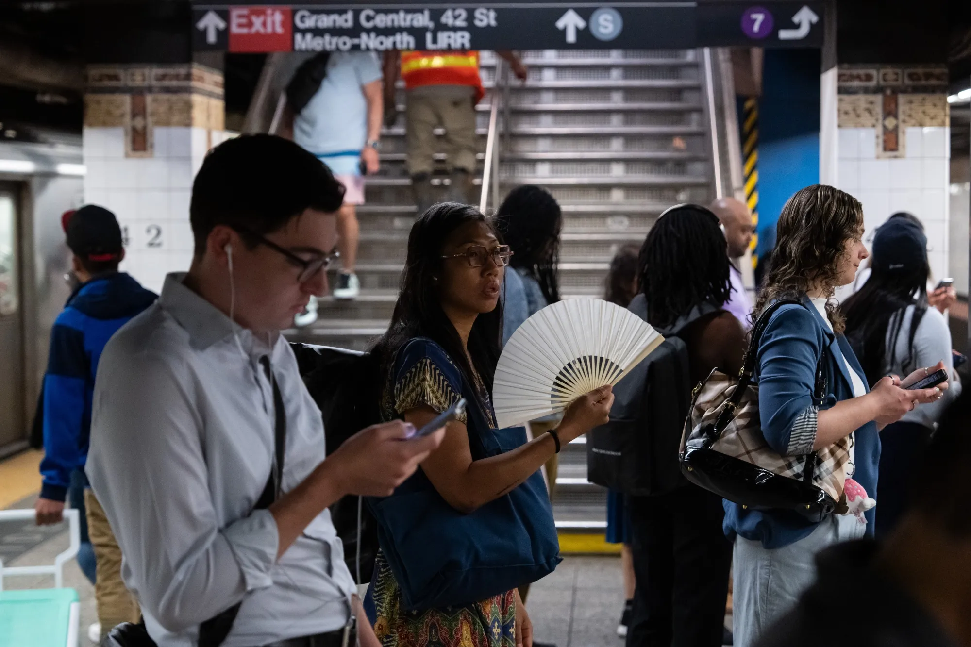 Commuters during high temperatures in New York.