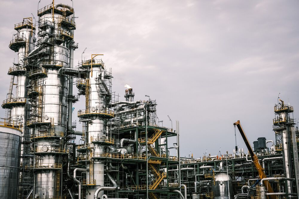 Stack towers at the Dangote oil refinery and fertilizer plant site in the Ibeju Lekki district, outside of Lagos, Nigeria.