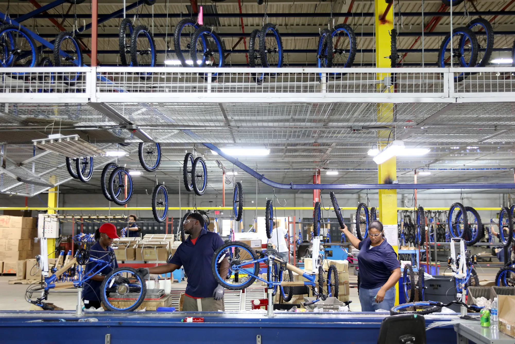 Employees on the assembly line at Kent International Inc.’s factory in Manning, South Carolina.