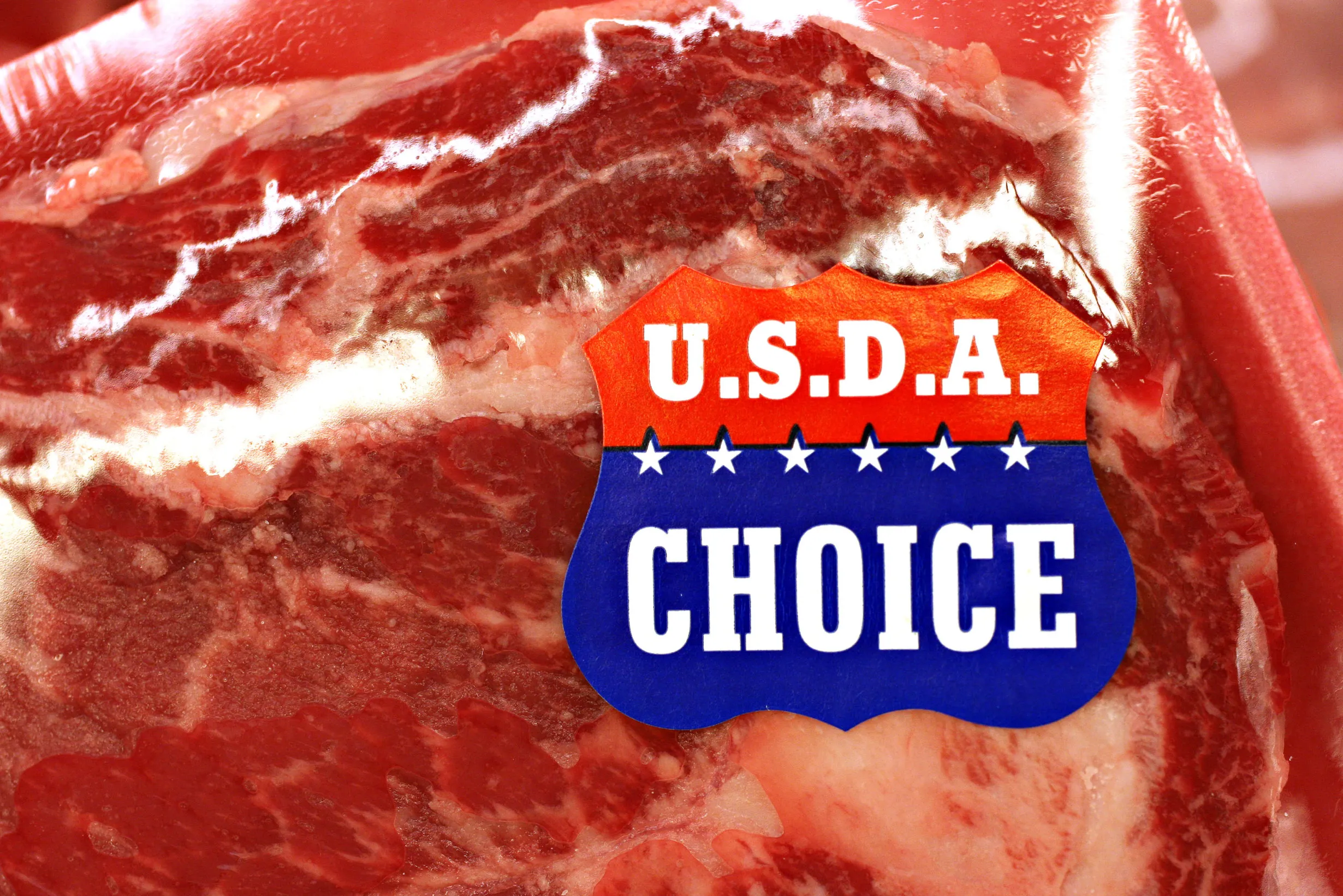 A USDA Choice sticker on a package of rib steak in a supermarket in New York.