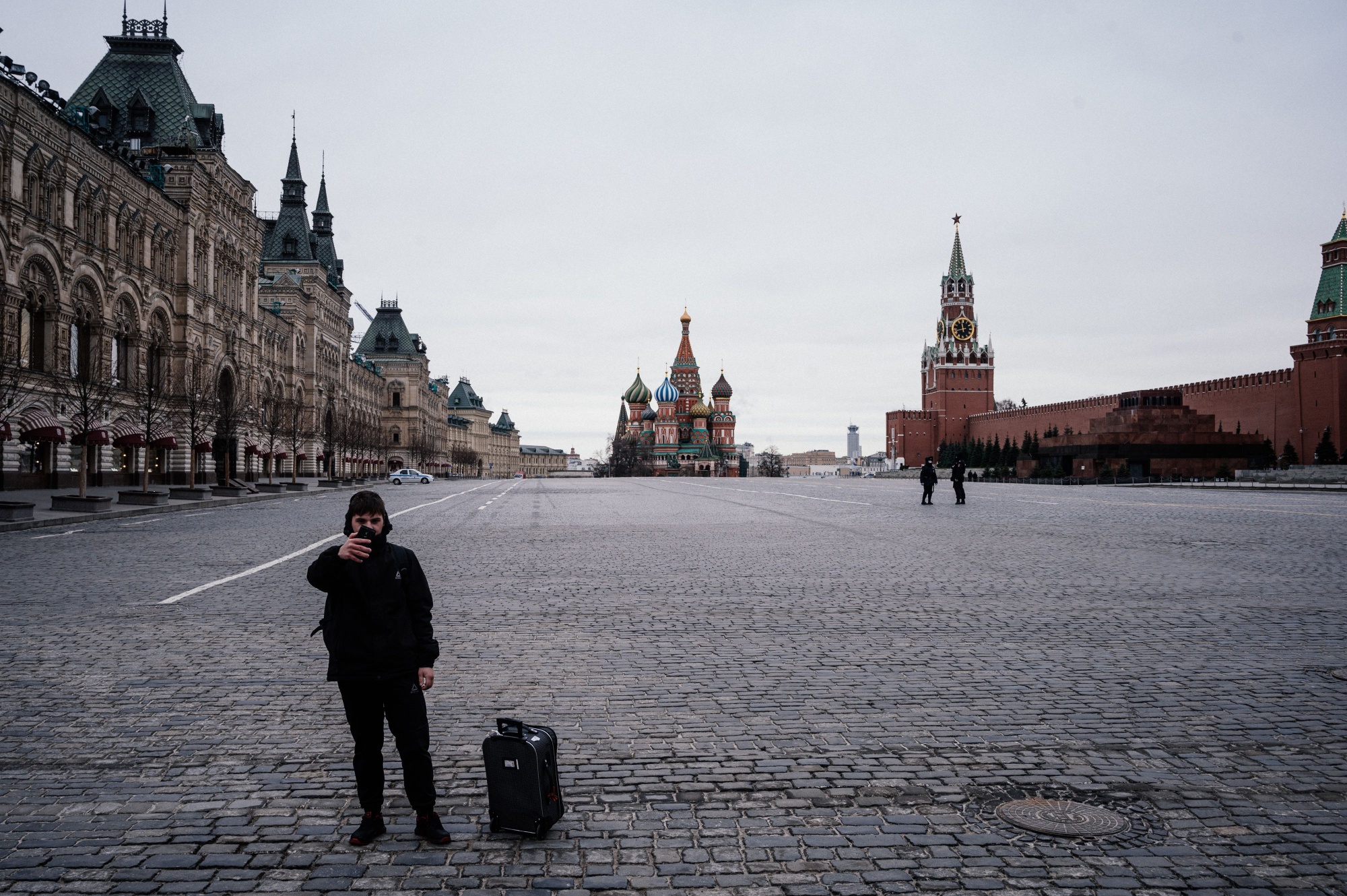 A tourist takes a selfie on the deserted Red square in Moscow on March 30.
