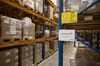 The AstraZeneca Plc logo sits on a sign on pharmaceutical and medical supply storage racks inside the Nippon Yusen K.K. pharma distribution center at the Port of Antwerp in Antwerp, Belgium, on Wednesday, May 10, 2017. The port is Europe's second-largest seaport and stands at the upper end of the tidal estuary of the River Scheldt.