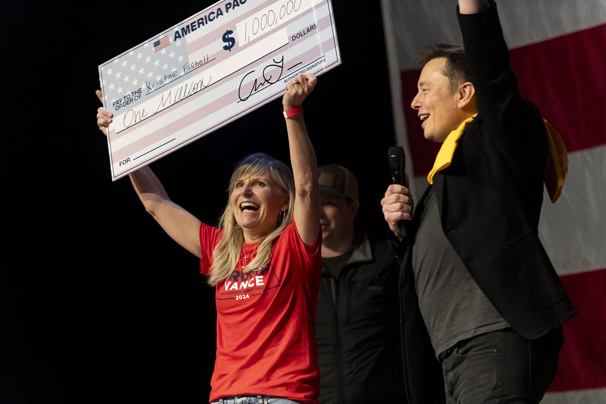 Elon Musk awarded Kristine Fishell with a $1 million check during a town hall&nbsp;in Pittsburgh, Pennsylvania, on Oct. 20.&nbsp;