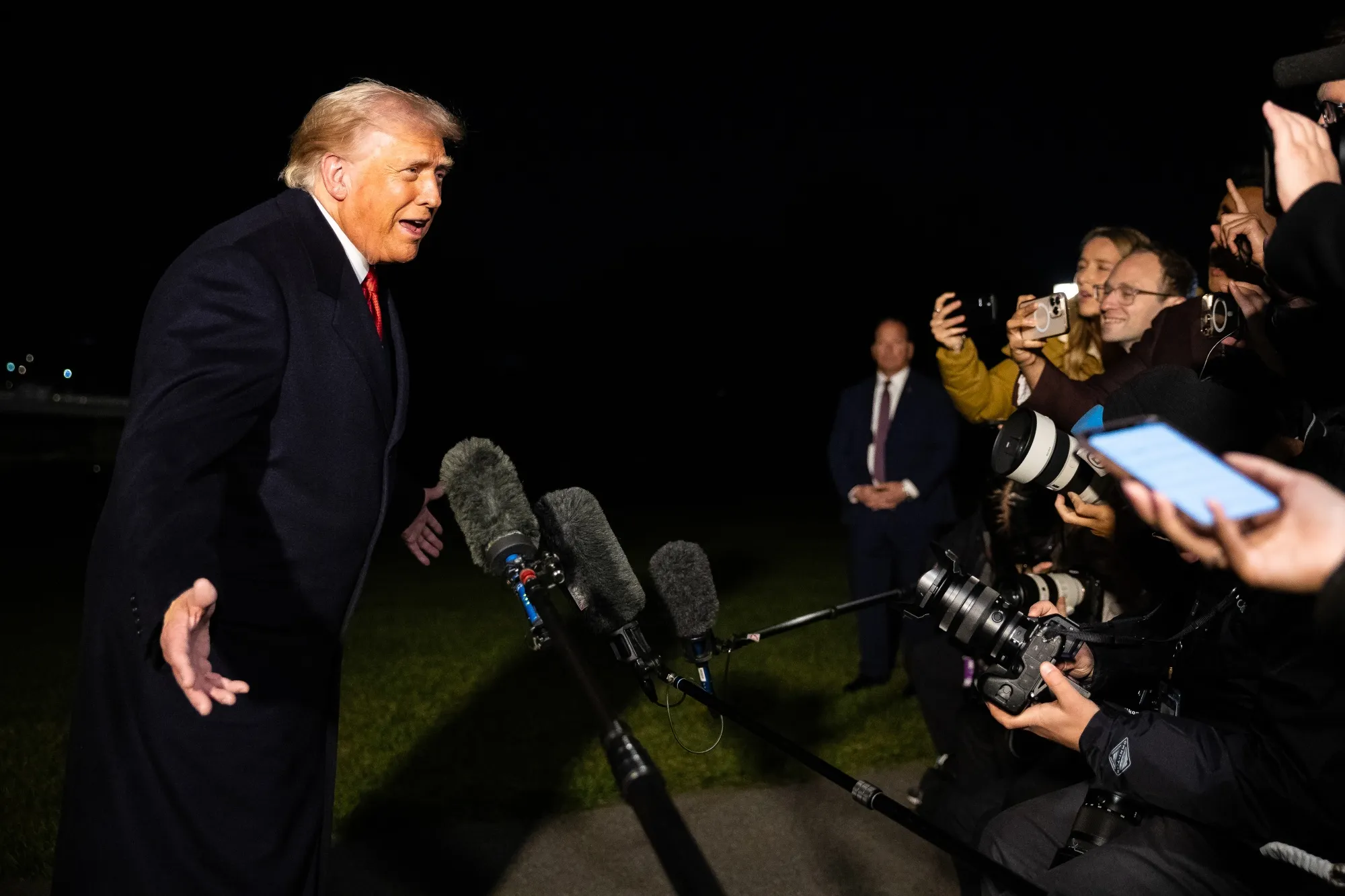 US President Donald Trump speaks to members of the media.