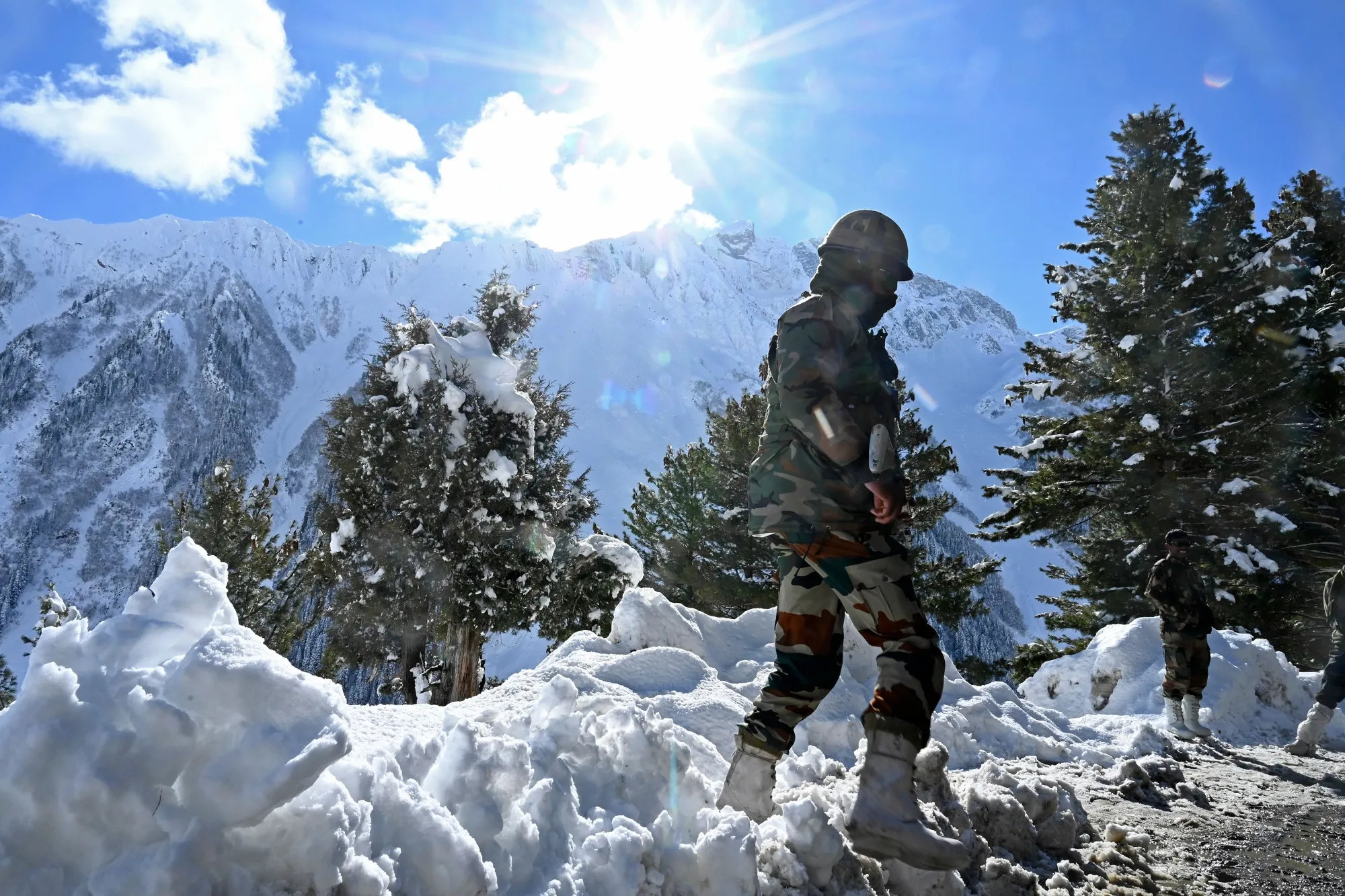 Indian soldiers stand near Zojila mountain pass, bordering China, in Nov. 2020.