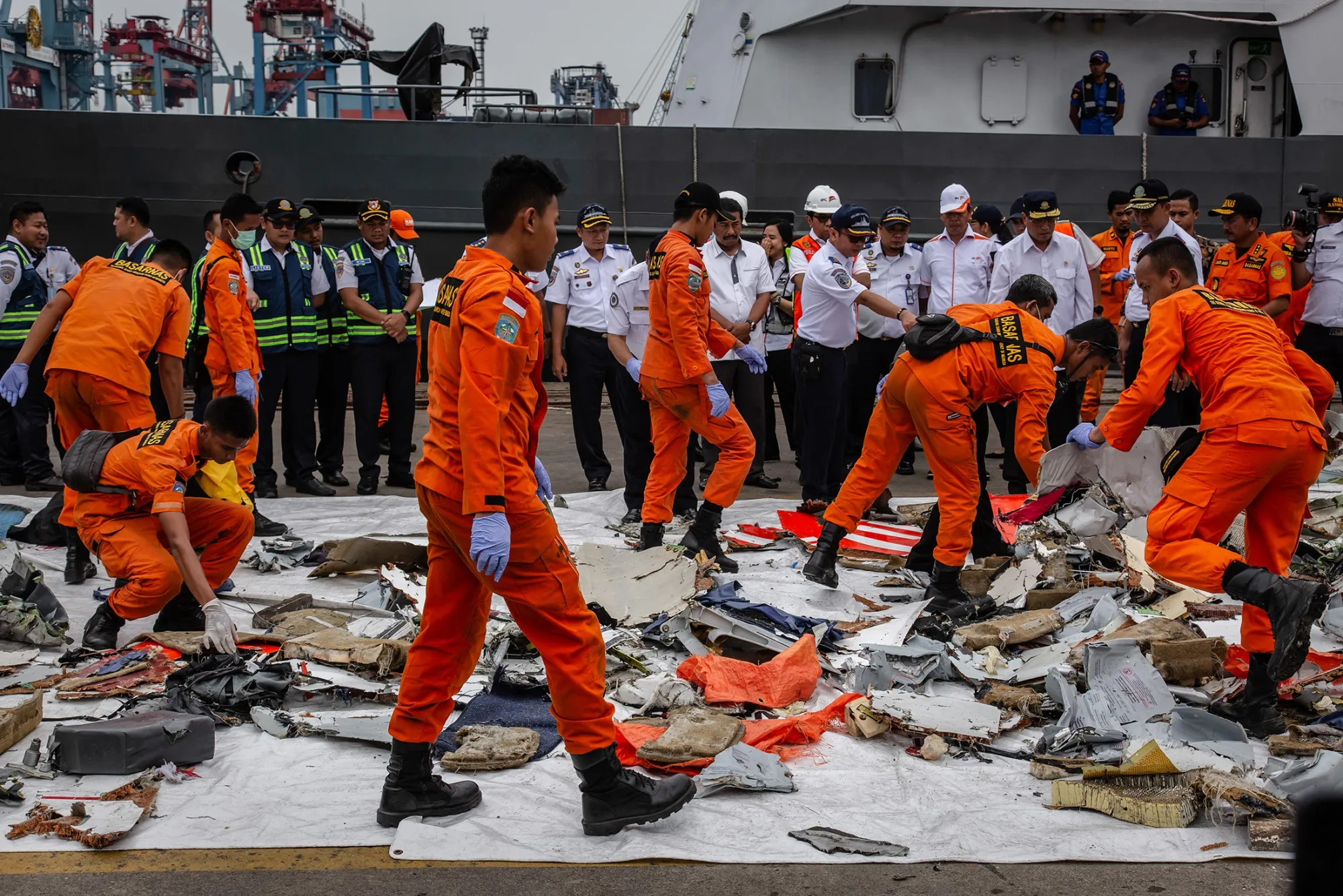 Search and Rescue personnel examine recovered debris from Lion Air flight JT 610 in Jakarta on Oct. 30.