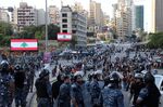 Lebanese riot police secure a road block during clashes between Hezbollah supporters and anti-government protesters in Beirut on Oct. 29.