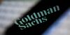 The Goldman Sachs bank logo is seen reflected on the screen of a mobile phone in this photo illustration on November 15, 2017. (Photo by Jaap Arriens/NurPhoto via Getty Images)