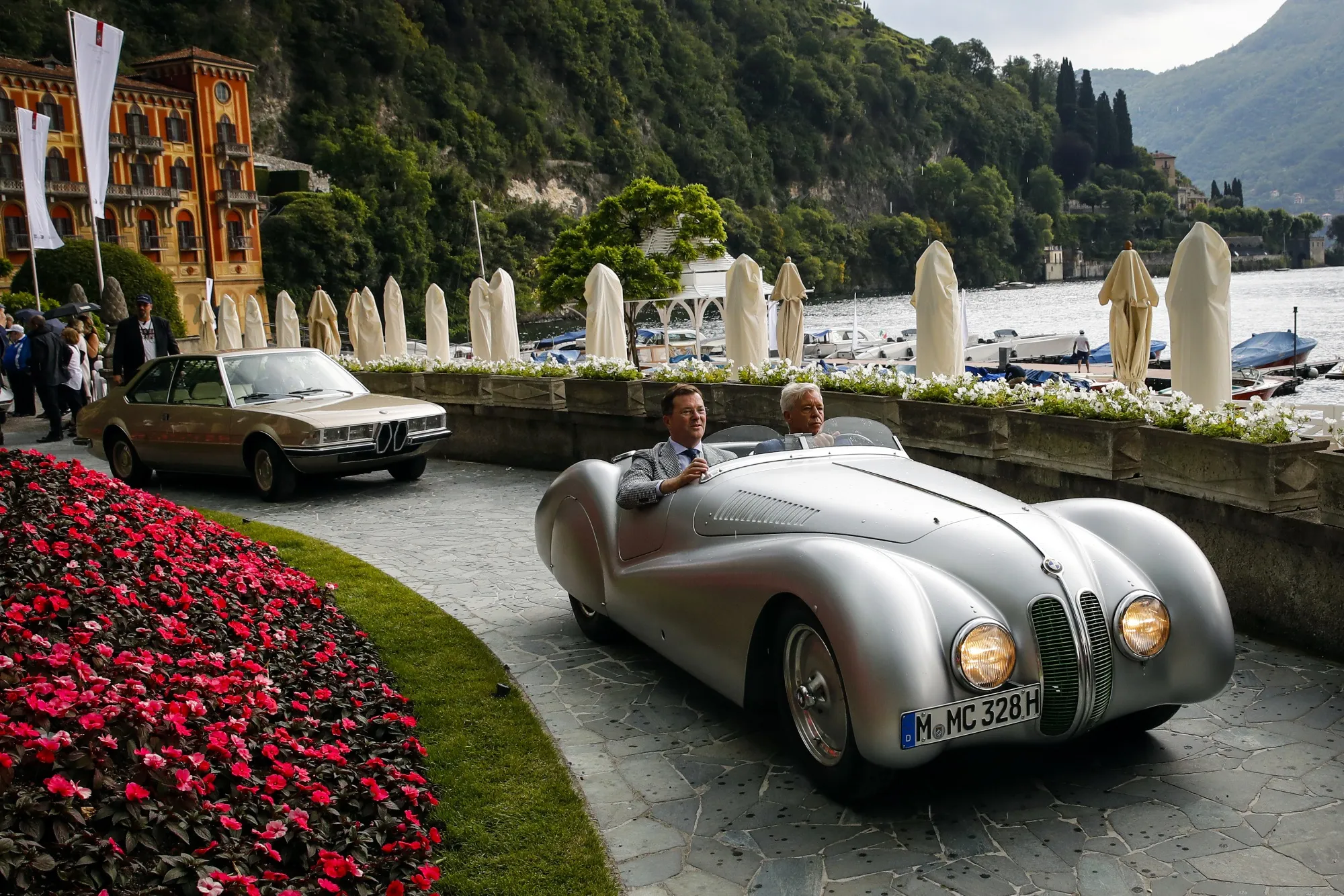 An entrant drives a classic car at the 2019 Concorso d’Eleganza Villa d’Este show by Lake Como, Italy.