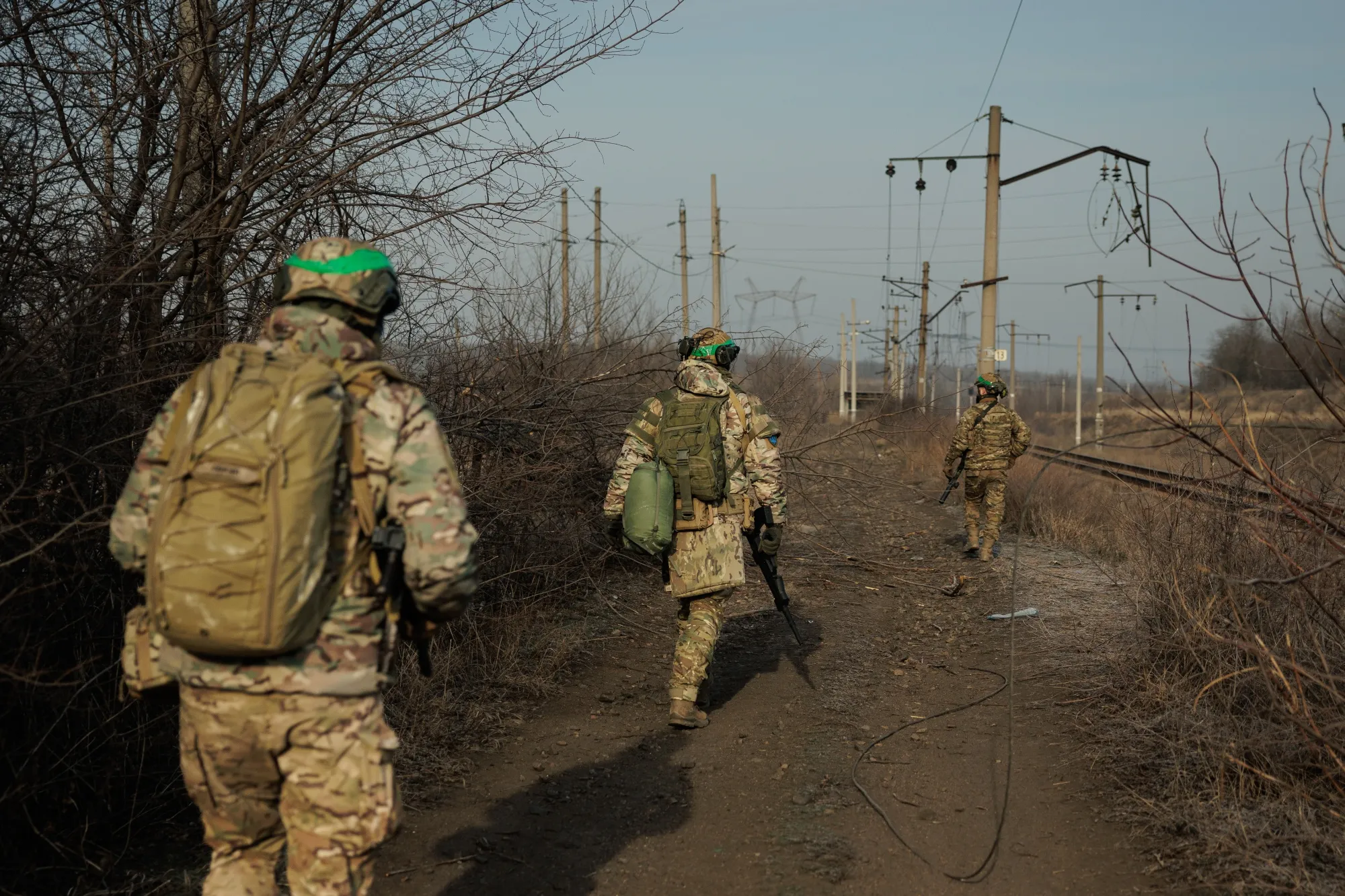 Ukrainian soldiers walk along the&nbsp;treeline on the outskirts of in Toretsk, Ukraine, on Feb. 14.&nbsp;