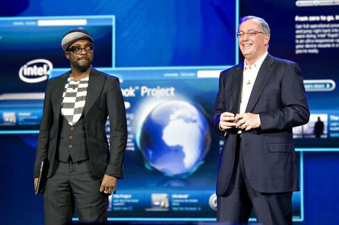 Will.i.am, left, with Paul Otellini, president and chief executive officer of Intel, during an event at CES 2012.