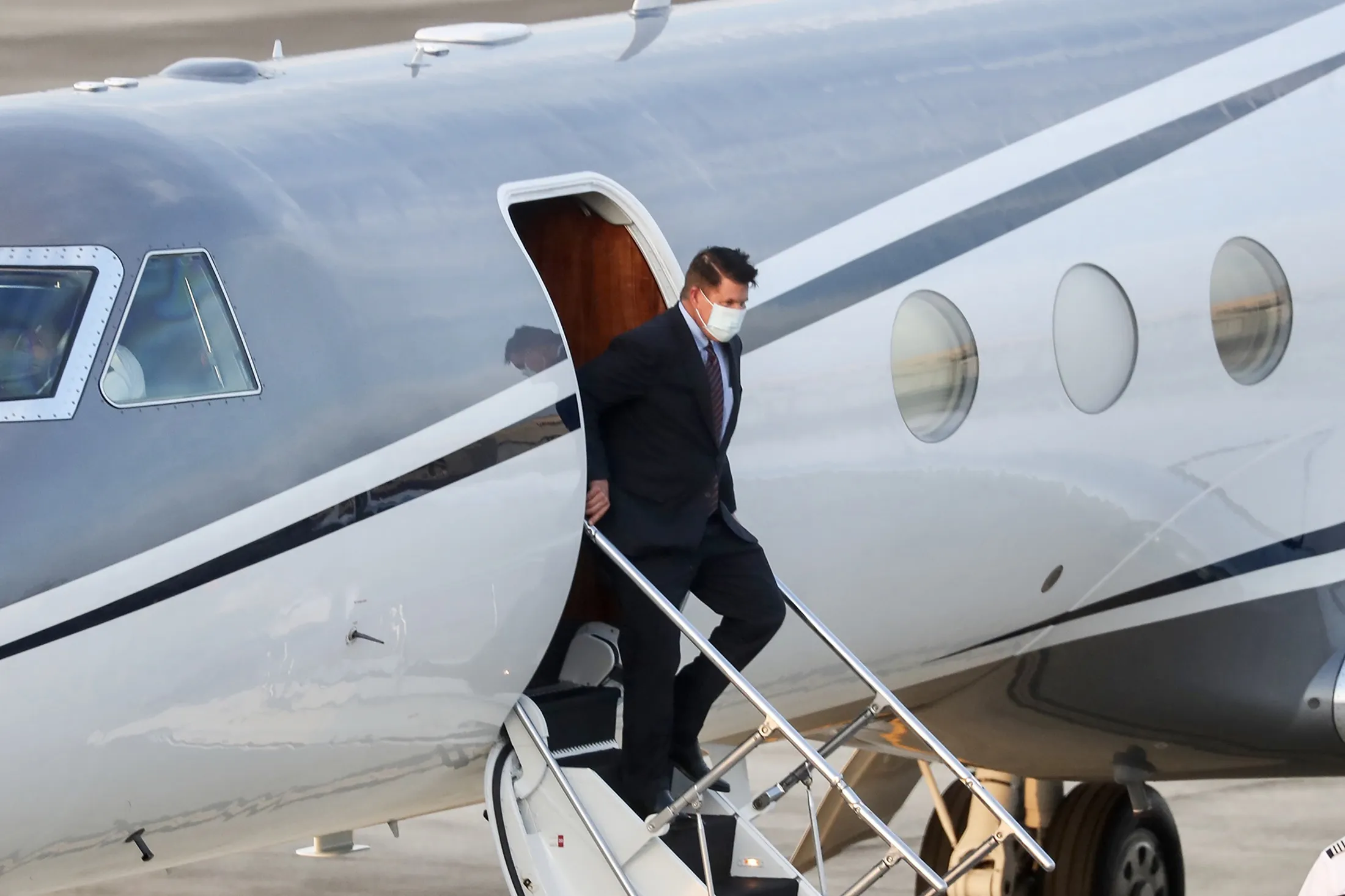 Keith Krach alights from an aircraft after landing at the Sungshan airport in Taipei on Sept. 17. 