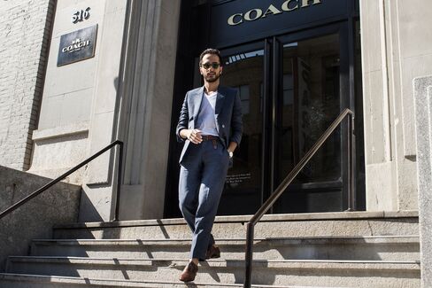 Moti attends the Coach presentation on the last day of shows in a roomier, linen suit by Born to Tailor, cotton v-neck T-shirt by Armani Exchange, and shoes by Louboutin.