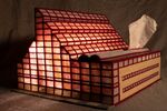 A demolished Cesar Pelli building reimagined in &quot;Disposable: Niagara Falls Winter Garden.&quot; Plastic canvas, acrylic yarn, LED lighting, tissue box, 11 x 15 x 22.5 inches, 2016.