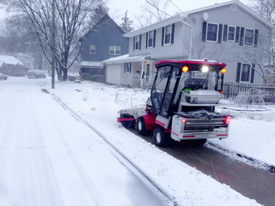 The SnowBuddy tractor, driven and funded by volunteers, clears all 12 miles of sidewalk of the Water Hill neighborhood of Ann Arbor, Michigan.
