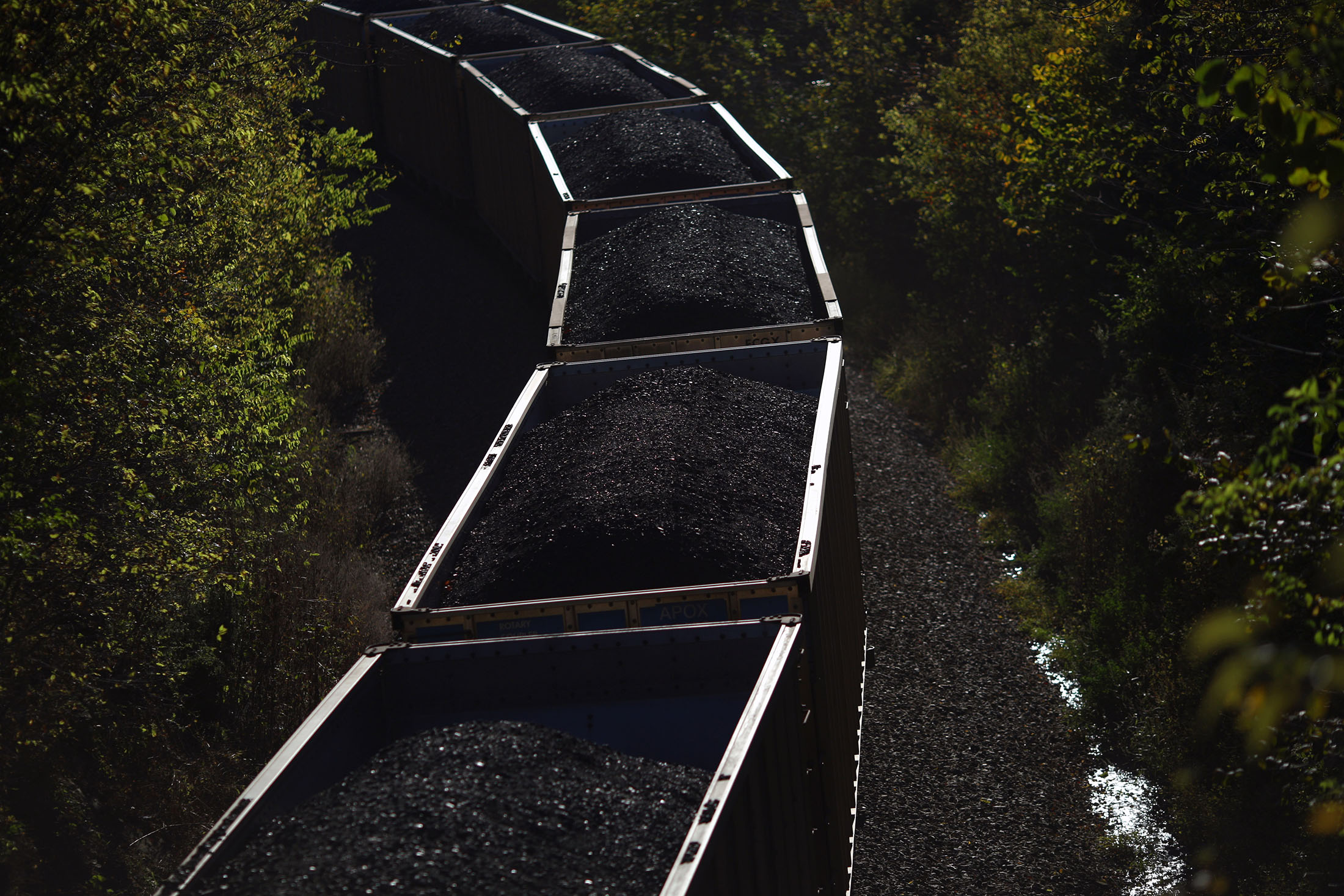 Hopper cars laden with coal trail behind an eastbound freight train heading through Waddy, Kentucky, U.S.