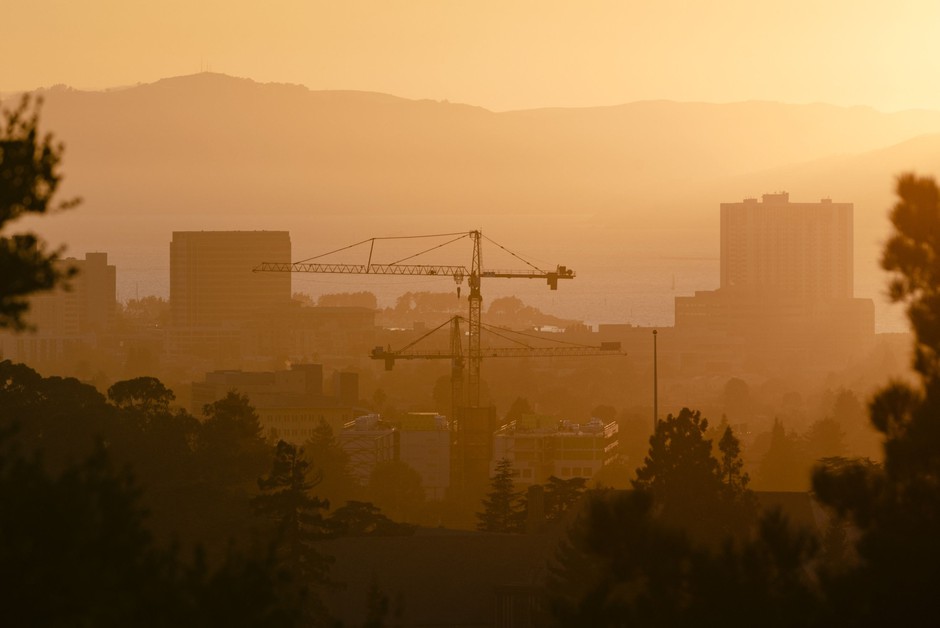 Cranes on the skyline in Oakland, California, where efforts to build more new housing have been more successful than in neighboring San Francisco.