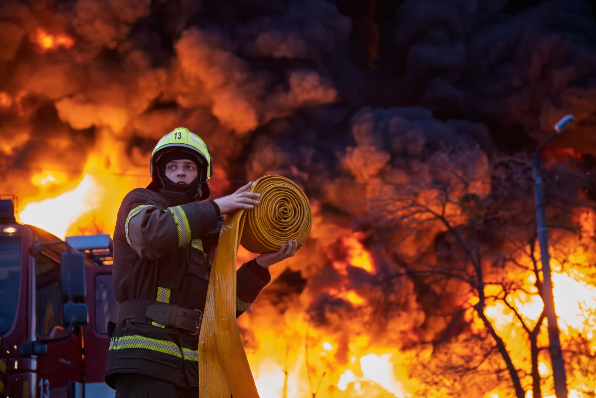 A firefighter works at the site of a Russian strike in Kyiv, on April 16.