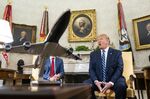 U.S. President Donald Trump, right, speaks while Justin Trudeau, Canada's prime minister, listens in the Oval Office of the White House.