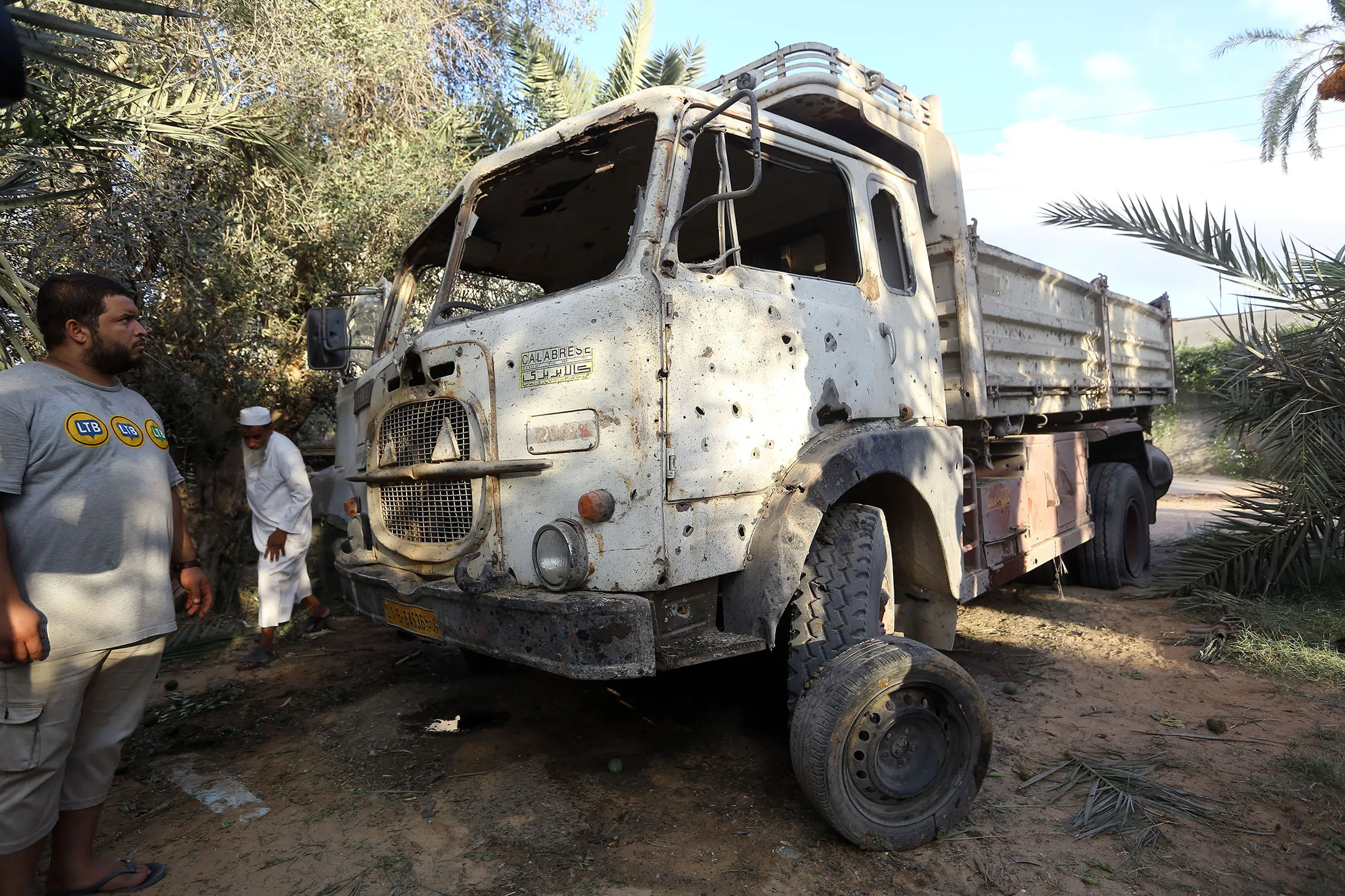 Libyans gather at the site of where a mortar shell landed in the capital Tripoli, on Aug&nbsp;30.&nbsp;