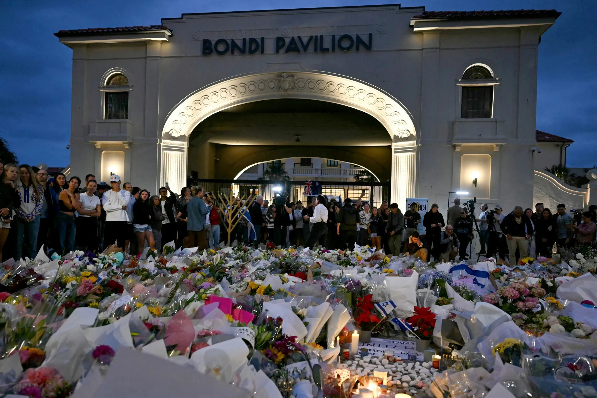 Mourners gather at a tribute at the Bondi Pavillion on Dec. 15.