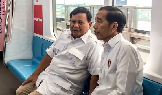Indonesia’s Widodo, Prabowo Share Train Ride After Bitter Feud