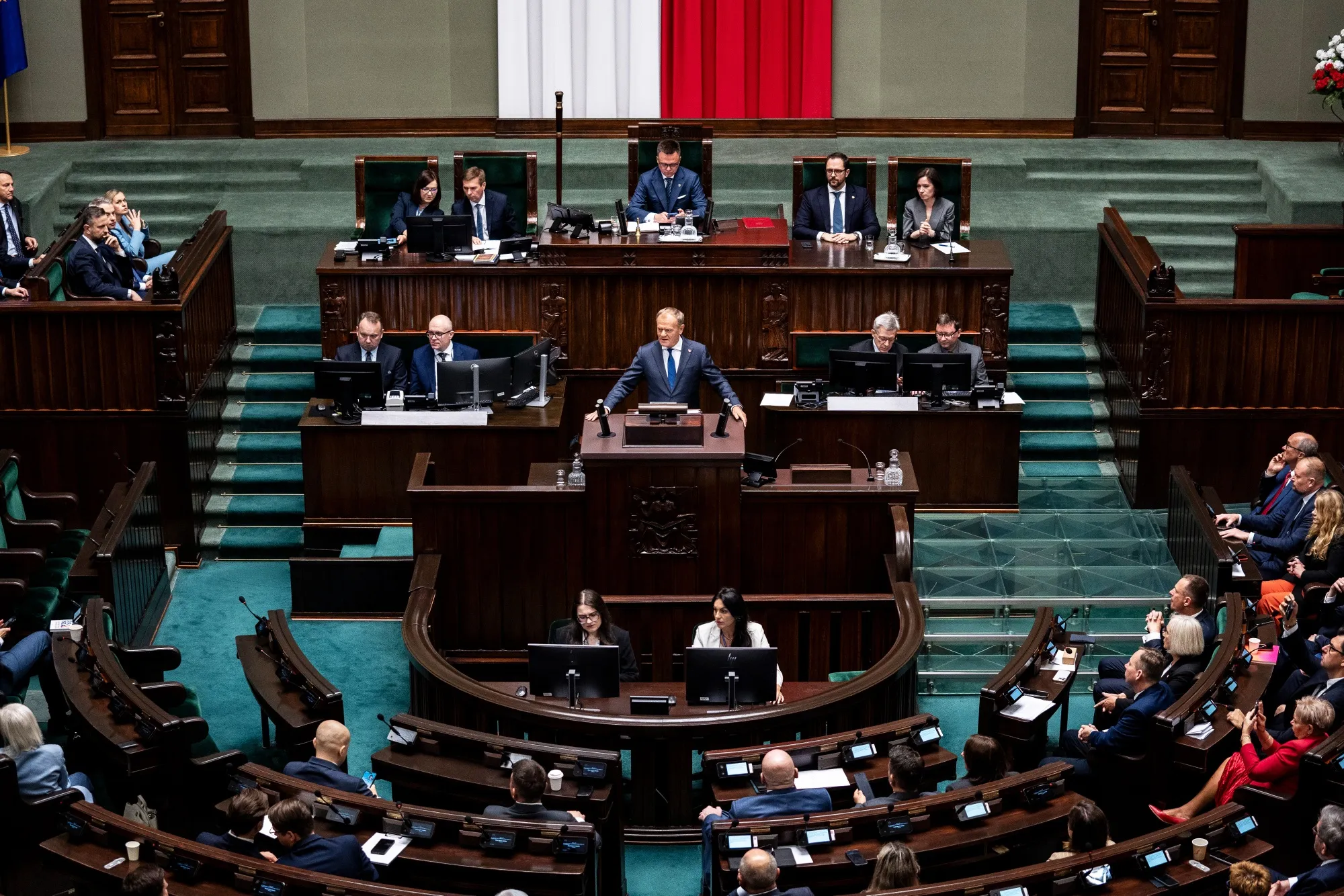 Donald Tusk speaks in the parliament in Warsaw, on June 11.