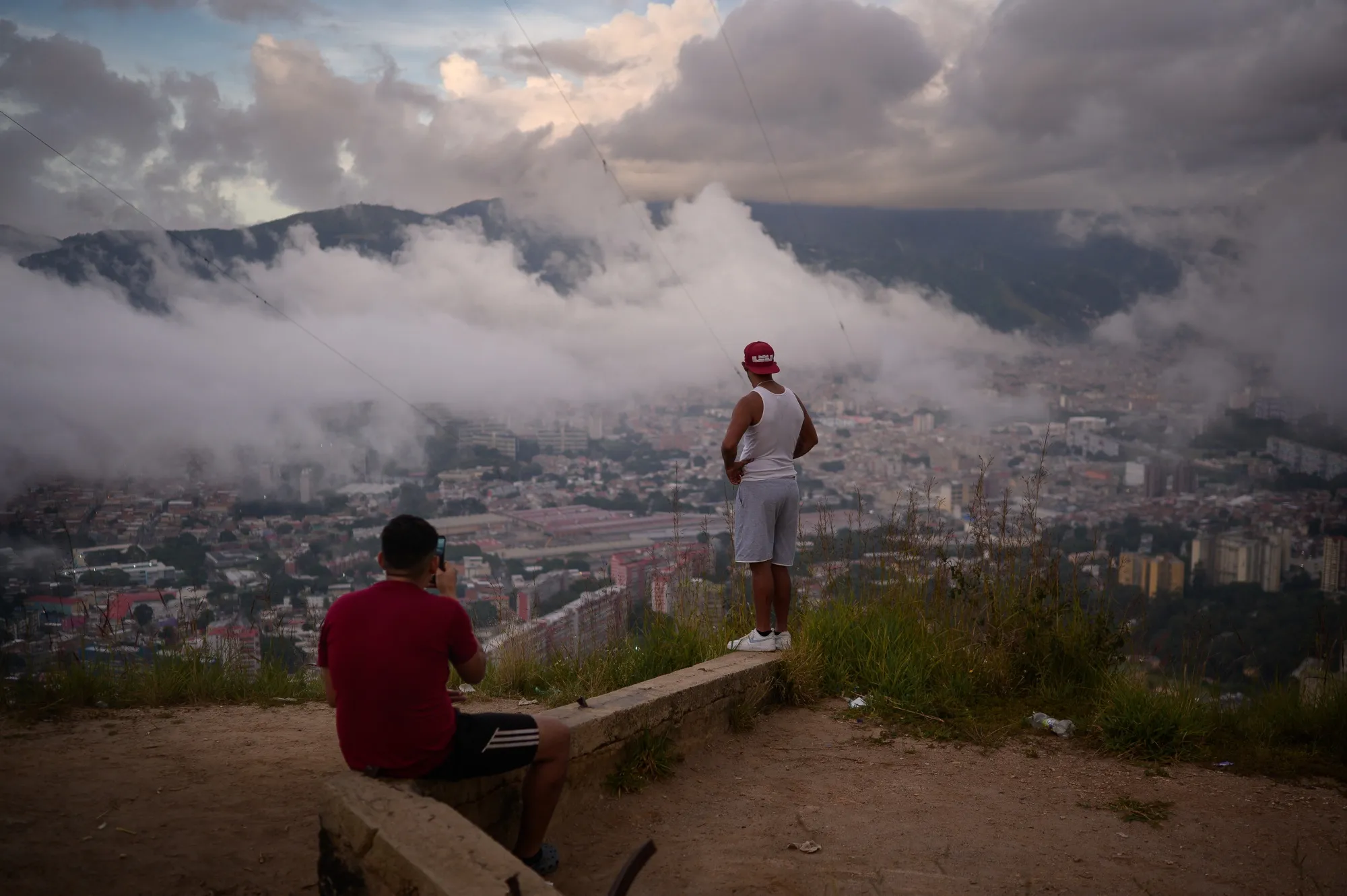 Residents look out from a view point over the skyline of Caracas, Venezuela, on Nov. 30.