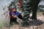 A U.S. Border Patrol agent assists undocumented minors near the U.S./Mexico border