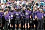 The Northwestern Football Team gather together during a time out during a game on Jan. 1, 2013 in Jacksonville