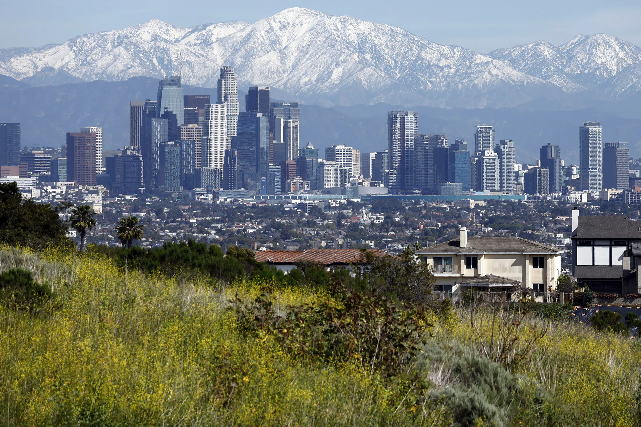 The downtown skyline beneath the snow-capped San Gabriel Mountains in Los Angeles, California,&nbsp;on Feb.&nbsp;23.