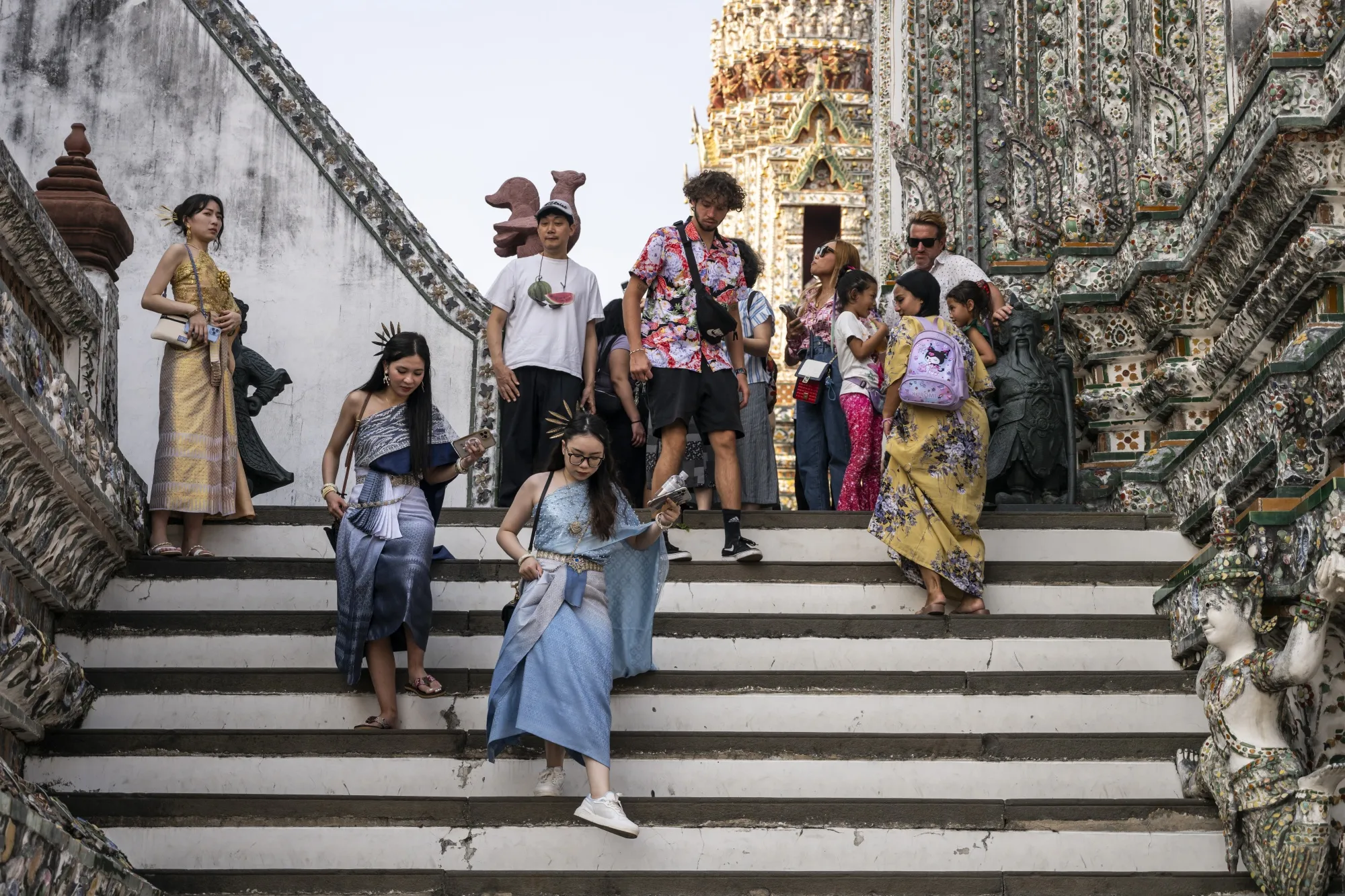 Tourists visit Wat Arun Ratchawararam Rathawaramahawihan in Bangkok.