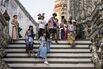 Tourists visit Wat Arun Ratchawararam Rathawaramahawihan in Bangkok