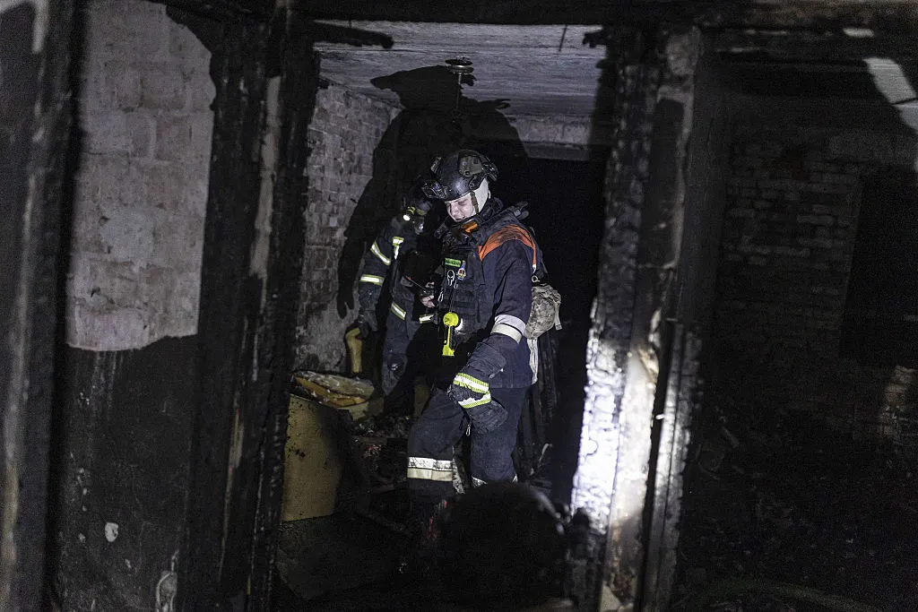 Ukrainian emergency service workers extinguish a fire in a residential building, after Russian shelling in Kostiantynivka, Ukraine on July 19.