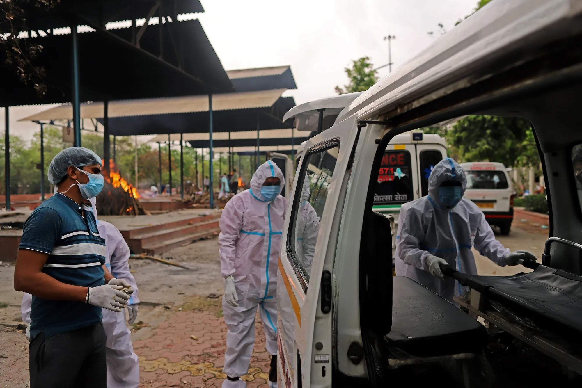 Ambulances lined up at a crematorium on the outskirts of New Delhi, on April 23.