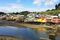 The stilted homes called palafitos of Chiloé’s traditional fishing villages inspired the architecture of the hotel, which rises above the ground on concrete piles.
